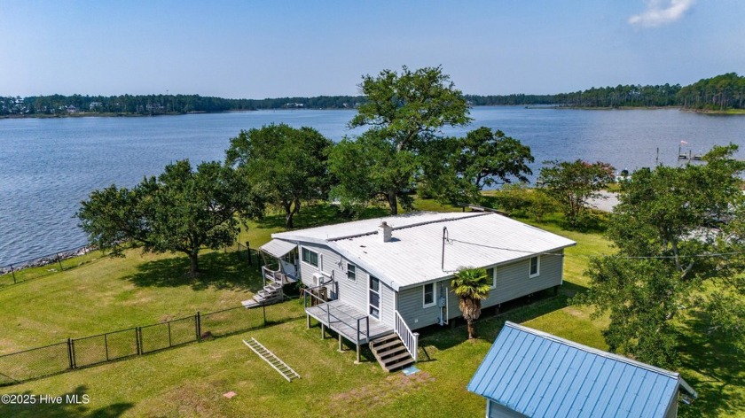 Rustic Coastal Retreat with Private Boat Ramp and Dock, Sweeping - Beach Home for sale in Merritt, North Carolina on Beachhouse.com
