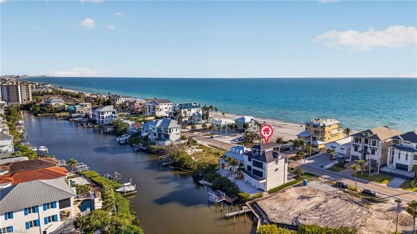 Sunrise over the bay. Sunset over the Gulf. Every single day - Beach Home for sale in Bonita Springs, Florida on Beachhouse.com