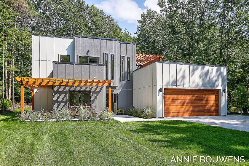 Discover contemporary living at its finest with this brand-new - Beach Home for sale in Holland, Michigan on Beachhouse.com