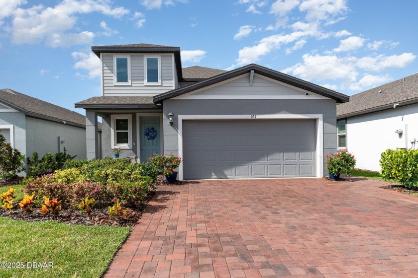 Better than new! Waterfront! This 4/2.5 stunning home with a - Beach Home for sale in Daytona Beach, Florida on Beachhouse.com