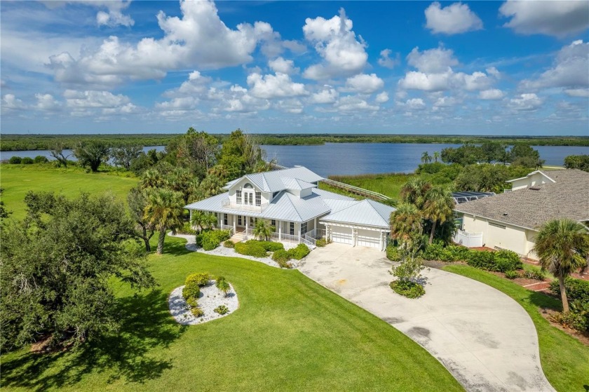 RIVERFRONT LIVING ON 1.27 ACRES IN PEACE RIVER CLUB W/NEW METAL - Beach Home for sale in Punta Gorda, Florida on Beachhouse.com