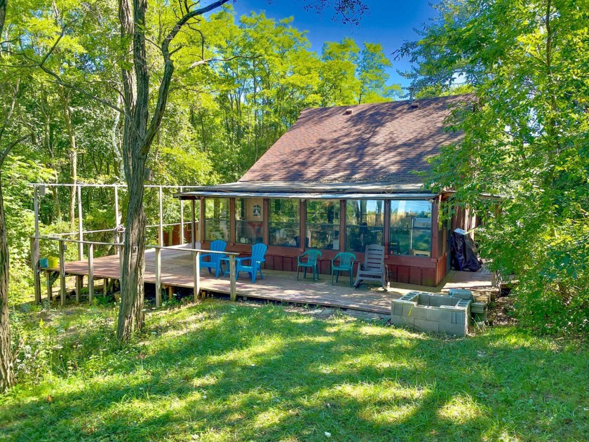 Tucked away in serene Claybanks township, this charming Lake - Beach Home for sale in New Era, Michigan on Beachhouse.com