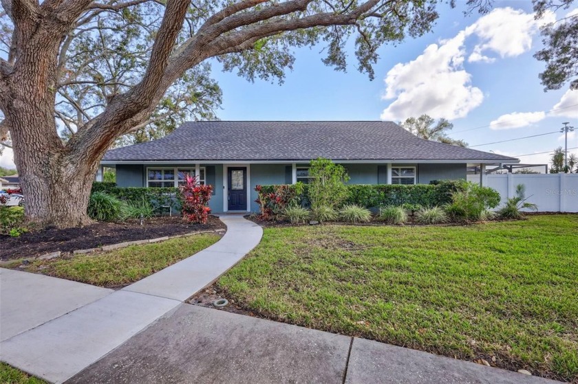 Nestled on a spacious corner lot in the sought-after Lake Park - Beach Home for sale in Seminole, Florida on Beachhouse.com