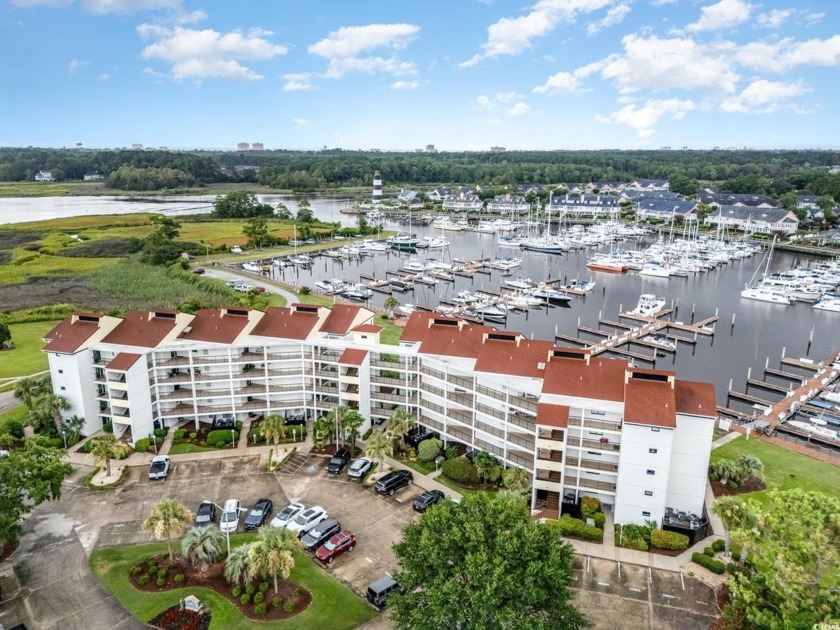 Welcome to Coquina Harbour! Step out and enjoy gorgeous Marina - Beach Condo for sale in Little River, South Carolina on Beachhouse.com