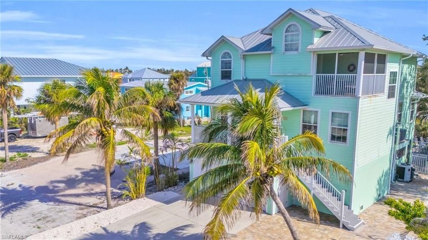 Step into your tropical retreat - a stunning 5-bedroom, 2 - Beach Home for sale in Fort Myers Beach, Florida on Beachhouse.com
