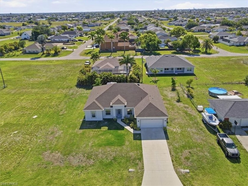 This beautifully designed 4-bedroom + den, 3 full bathroom home - Beach Home for sale in Cape Coral, Florida on Beachhouse.com