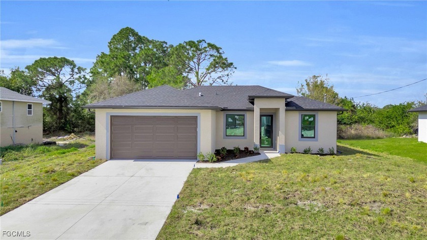 This beautifully designed 3-bedroom, 2-bathroom home with a - Beach Home for sale in Lehigh Acres, Florida on Beachhouse.com
