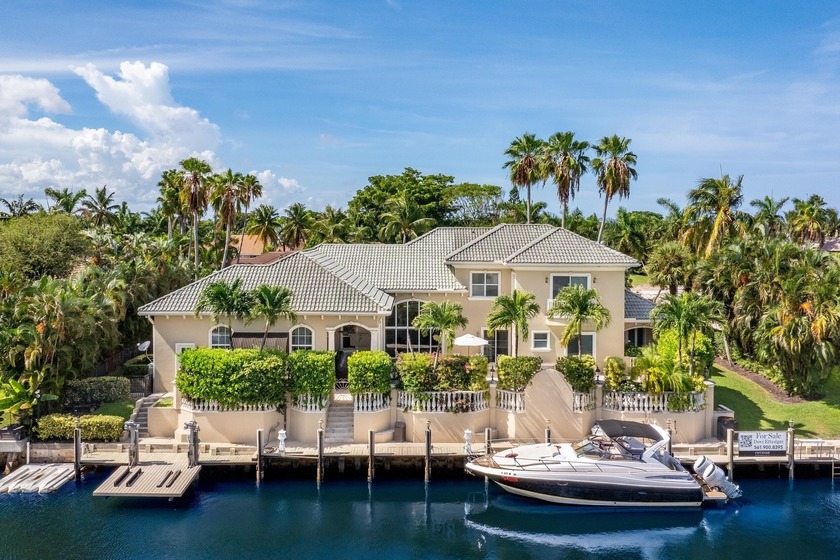 Tucked within the prestigious enclave of Boca Bay Colony, this - Beach Home for sale in Boca Raton, Florida on Beachhouse.com