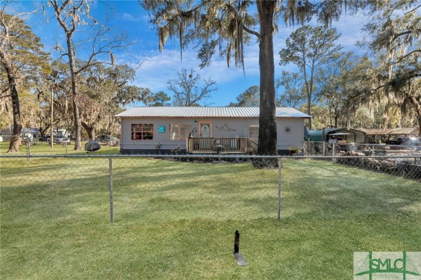 Welcome to your coastal oasis at Shellman Bluff! This unique and - Beach Home for sale in Shellman Bluff, Georgia on Beachhouse.com