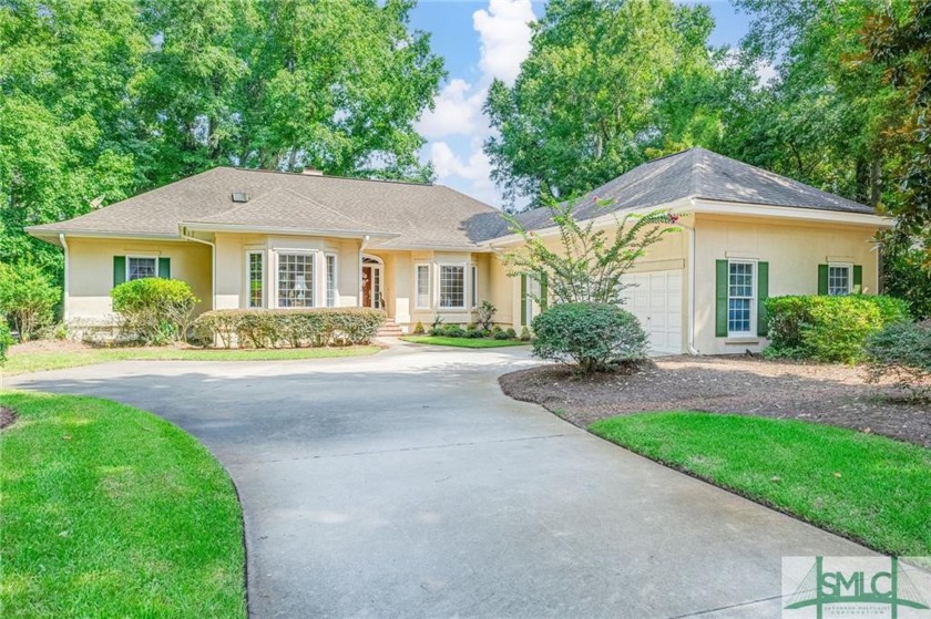 This hard-coat stucco home is positioned on a beautiful lot with - Beach Home for sale in Savannah, Georgia on Beachhouse.com