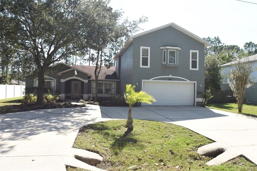 Amazing opportunity to own a beautiful 4BR/3BA pool home in an - Beach Home for sale in Palm Coast, Florida on Beachhouse.com