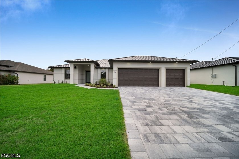 Brand-new 4-bedroom, 3-bath pool home by MAGNA Homes featuring - Beach Home for sale in Cape Coral, Florida on Beachhouse.com