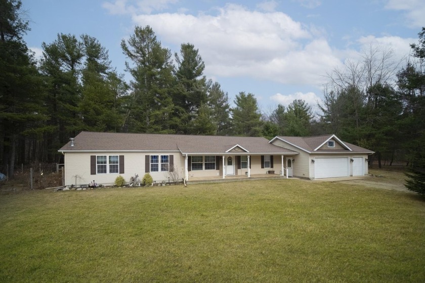 Exceptional 2108 sq ft of one floor living on nearly one acre of - Beach Home for sale in Onekama, Michigan on Beachhouse.com