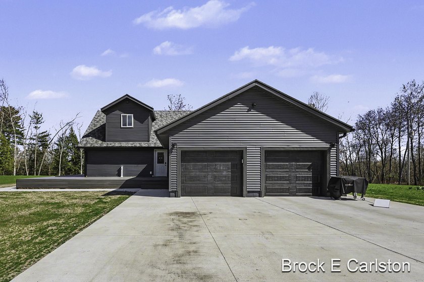 Set on 40 acres, this beautifully updated 4-bedroom, 2-bath home - Beach Home for sale in Muskegon, Michigan on Beachhouse.com