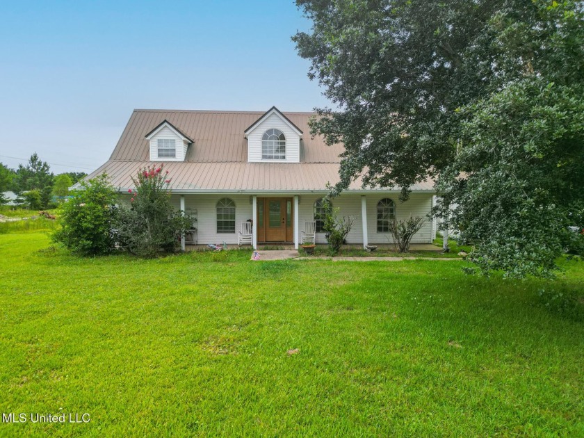 Nestled on 2.2 beautiful acres in Long Beach, this charming - Beach Home for sale in Long Beach, Mississippi on Beachhouse.com