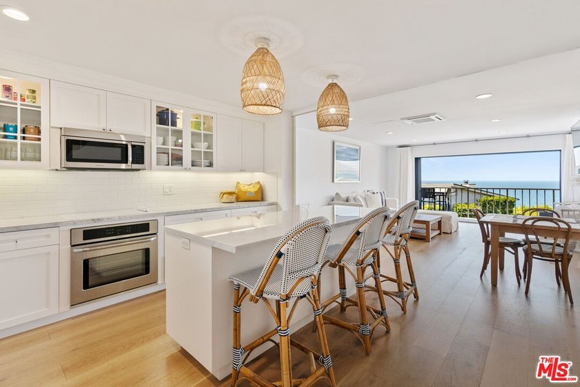 Set on a prime blufftop in Zuma Bay Villas, this residence - Beach Condo for sale in Malibu, California on Beachhouse.com