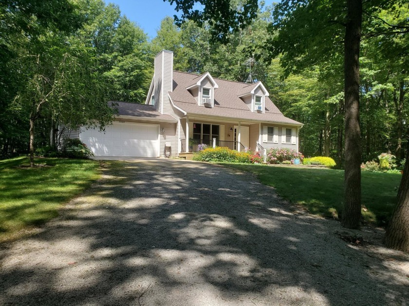 Nestled in the serene beauty of West Michigan's lakeshore, this - Beach Home for sale in West Olive, Michigan on Beachhouse.com