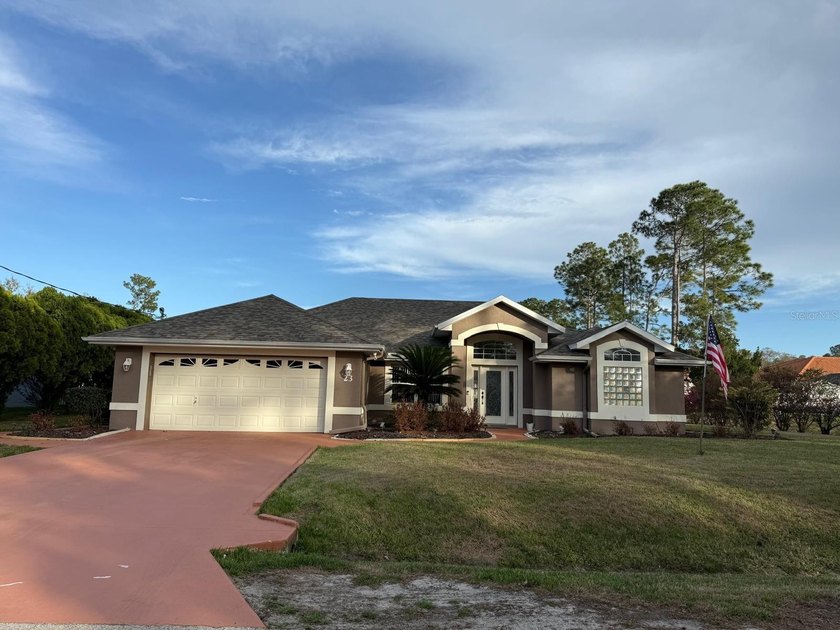 Step into this meticulously maintained three-bedroom, two-bath - Beach Home for sale in Palm Coast, Florida on Beachhouse.com