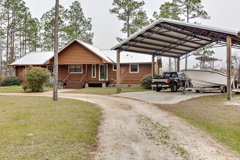 Charming log cabin on 1 acre along the Carrabelle River - Beach Home for sale in Carabelle, Florida on Beachhouse.com