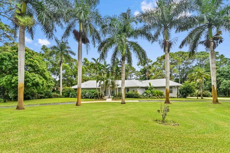 Nestled on a sprawling 1.36-acre corner lot in the serene - Beach Home for sale in Palm Beach Gardens, Florida on Beachhouse.com