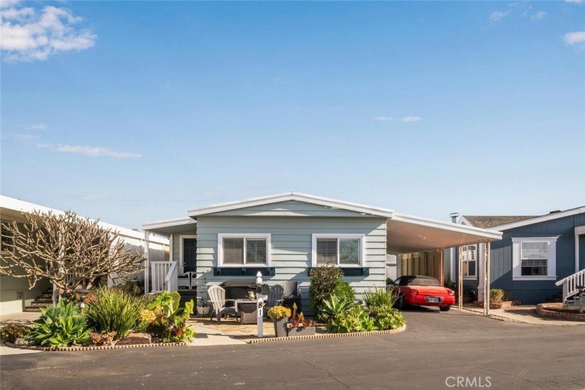 Nestled in the highly sought-after Rancho del Rey Mobile Home - Beach Home for sale in Huntington Beach, California on Beachhouse.com