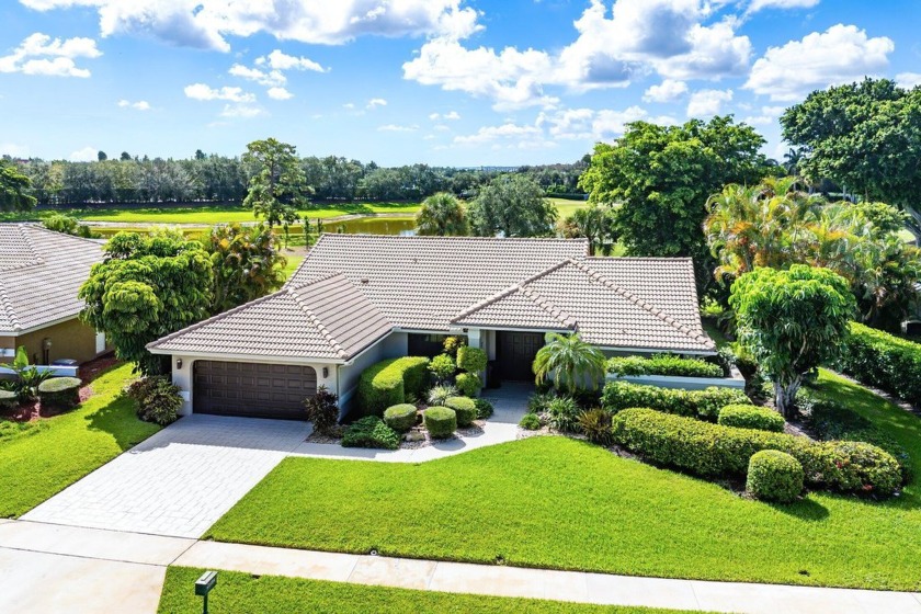 Set in the prestigious Boca Woods Country Club, this - Beach Home for sale in Boca Raton, Florida on Beachhouse.com