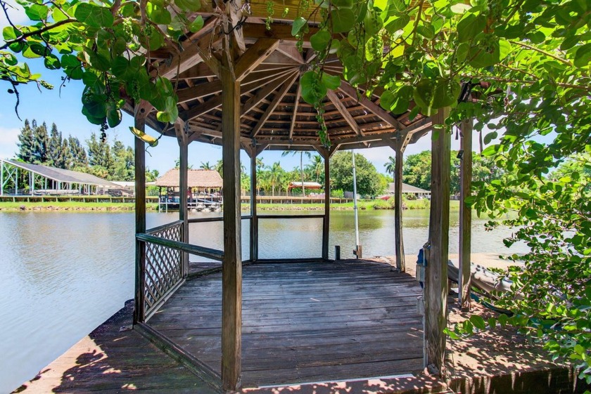 BEYOND THE GATE Lies Your Private Caribbean Paradise. Tucked - Beach Home for sale in West Palm Beach, Florida on Beachhouse.com
