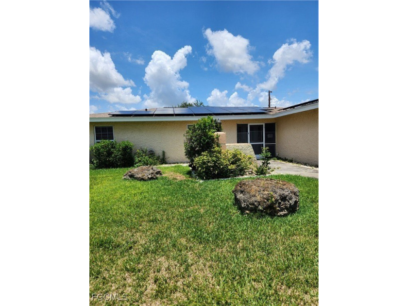 This beautiful pool home is conveniently located in SE Cape - Beach Home for sale in Cape Coral, Florida on Beachhouse.com