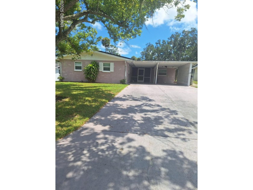 This charming 3-bedroom, 2-bath residence offers the perfect - Beach Home for sale in Daytona Beach, Florida on Beachhouse.com