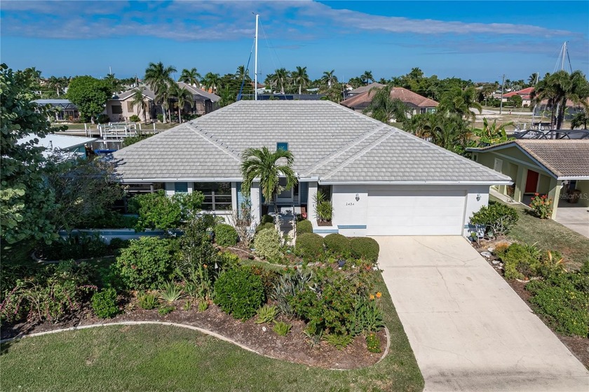 WATERFRONT HOME IN PGI W/**NEW TILE ROOF** & NEARLY INSTANT - Beach Home for sale in Punta Gorda, Florida on Beachhouse.com