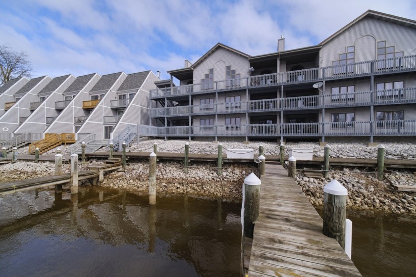 Welcome to this beautifully updated 2-bed, 1-bath end-unit - Beach Condo for sale in Manistee, Michigan on Beachhouse.com