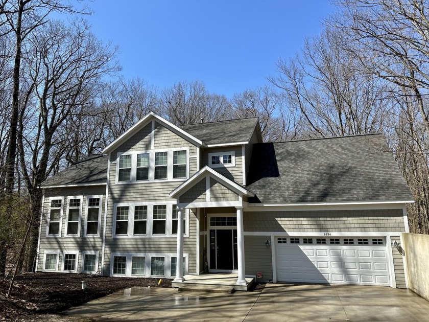 Nestled amidst serene woods, minutes from Lake Michigan, this - Beach Home for sale in Coloma, Michigan on Beachhouse.com