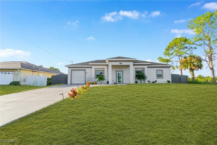 Welcome to this beautifully maintained 2023 home featuring 3 - Beach Home for sale in Lehigh Acres, Florida on Beachhouse.com