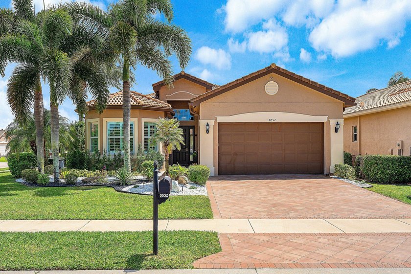 This lushly landscaped Bimini model sits on an oversized corner - Beach Home for sale in Boynton Beach, Florida on Beachhouse.com