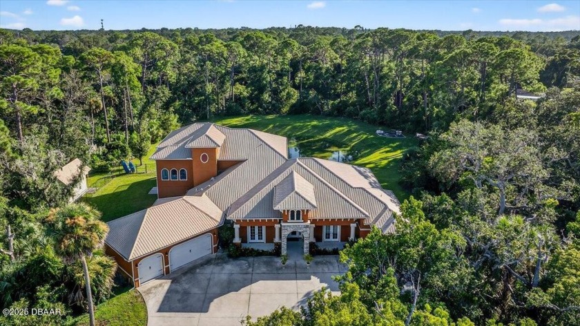 Tucked away on over 3 acres of secluded paradise in the center - Beach Home for sale in Port Orange, Florida on Beachhouse.com