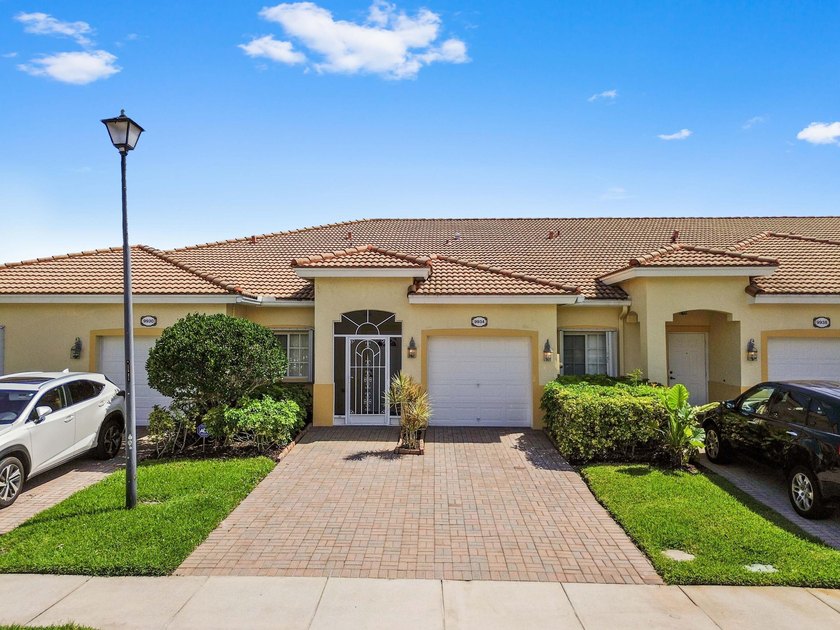 Experience serene lakefront living in this immaculately - Beach Home for sale in West Palm Beach, Florida on Beachhouse.com