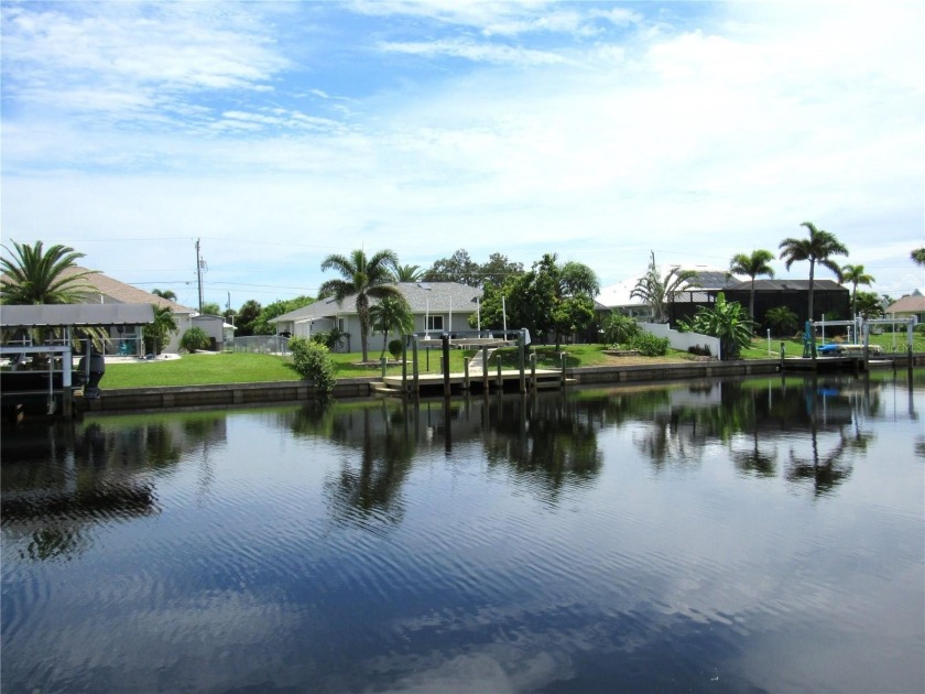 THIS GULF ACCESS PROPERTY IS AN INCREDIBLE VALUE!  With no fixed - Beach Home for sale in Port Charlotte, Florida on Beachhouse.com