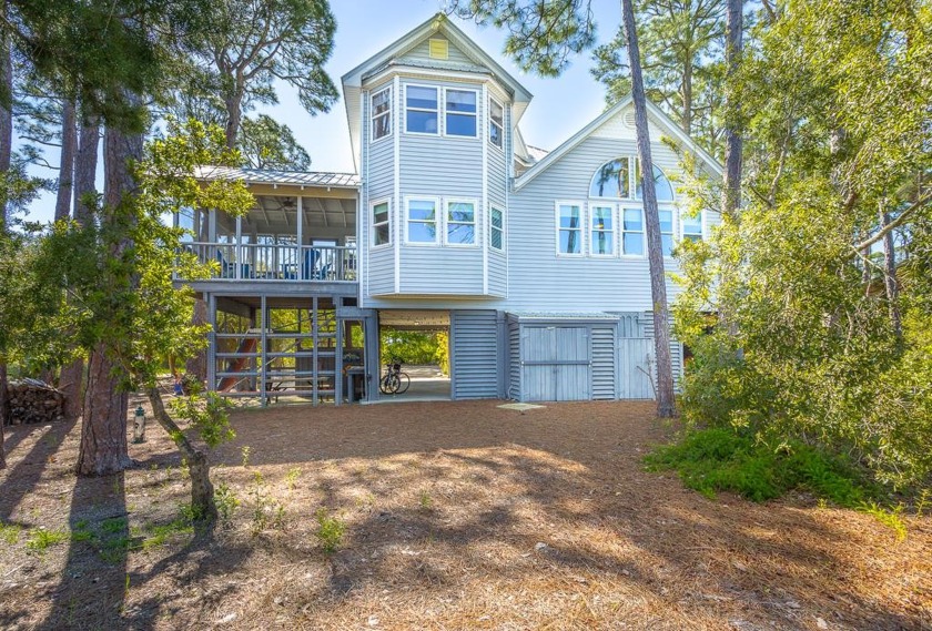 Experience the epitome of coastal living in this exceptional 3 - Beach Home for sale in St. George Island, Florida on Beachhouse.com