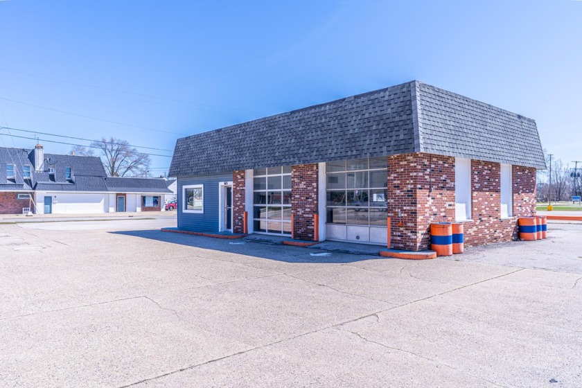 Located on a busy corner near Muskegon Lake and just minutes - Beach Commercial for sale in Norton Shores, Michigan on Beachhouse.com