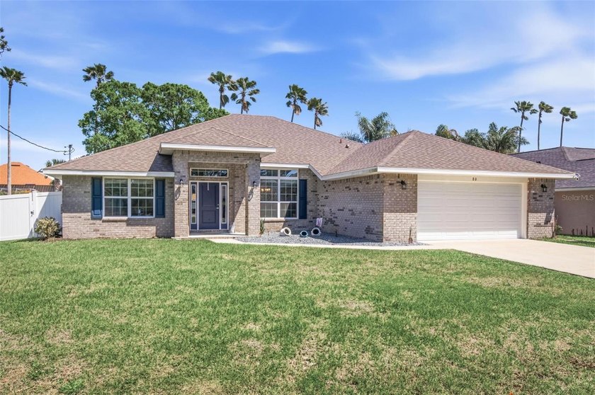 Welcome to 80 Burning Bush Drive in beautiful Palm Coast! This - Beach Home for sale in Palm Coast, Florida on Beachhouse.com
