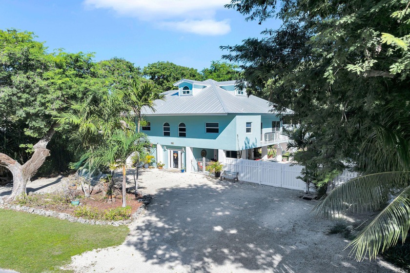 A MUST SEE! Welcome to this Key Largo 3-level home on a double - Beach Home for sale in Key Largo, Florida on Beachhouse.com