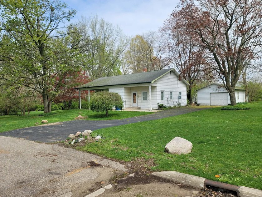 Charming bungalow set on a rare .86-acre city lot with mature - Beach Home for sale in Coloma, Michigan on Beachhouse.com