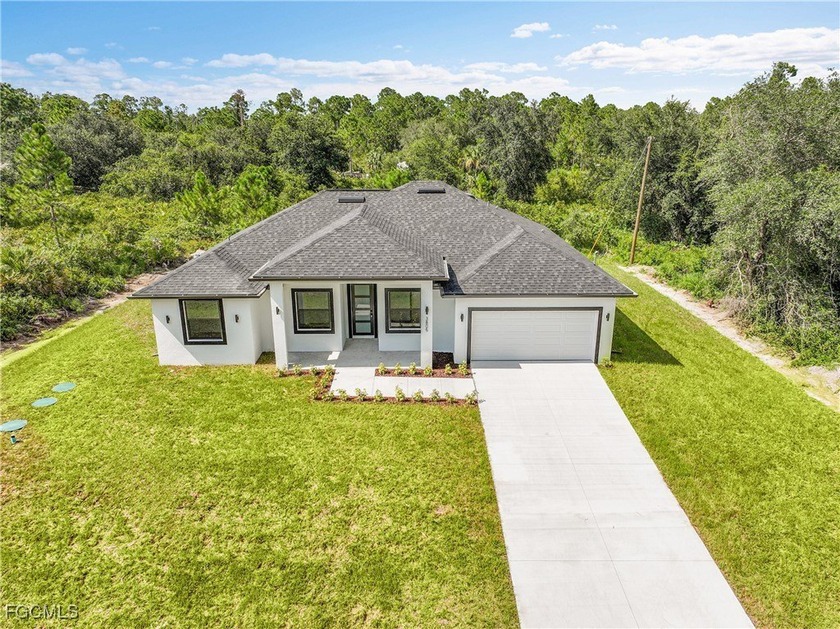 Discover this brand-new 4 bedroom + den, 3 bathroom home - Beach Home for sale in Lehigh Acres, Florida on Beachhouse.com