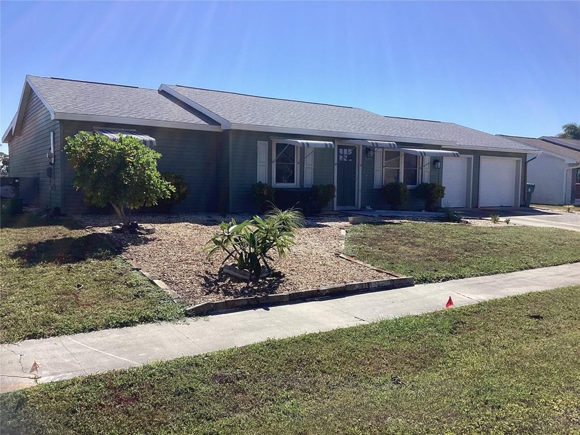 FRESH WATER, CANAL FRONT REMODELED 2 BR, 2 BA ADORABLE HOME WITH - Beach Home for sale in Port Charlotte, Florida on Beachhouse.com