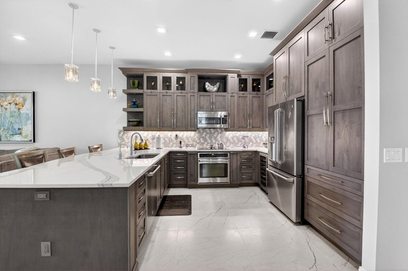 This magnificent 2-bedroom, 2.5-bath home with a versatile den - Beach Home for sale in Boynton Beach, Florida on Beachhouse.com