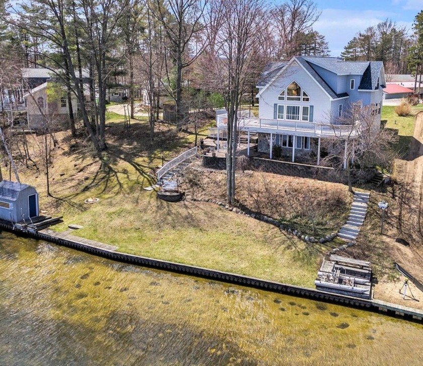 100 ft of Beautiful Upper Silver Waterfront. This chalet style - Beach Home for sale in Mears, Michigan on Beachhouse.com