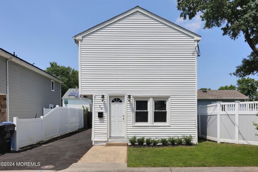 This newly renovated 3-bedroom, 1-bath home is nestled on a - Beach Home for sale in North Middletown, New Jersey on Beachhouse.com