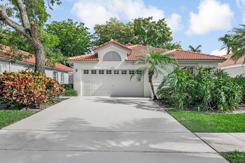 You must see this home in Palm Isles, a vibrant 55+ community - Beach Home for sale in Boynton Beach, Florida on Beachhouse.com
