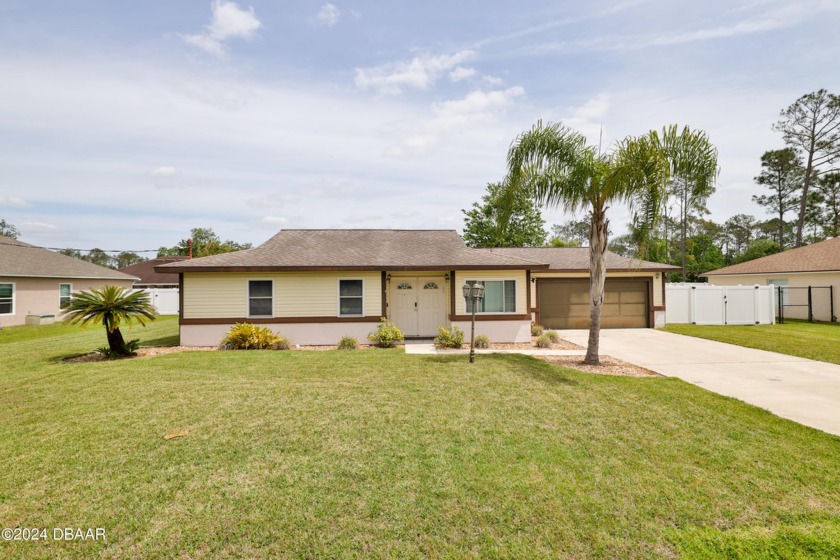 This charming 3 bedroom/3 bath home is located in a desirable - Beach Home for sale in Palm Coast, Florida on Beachhouse.com