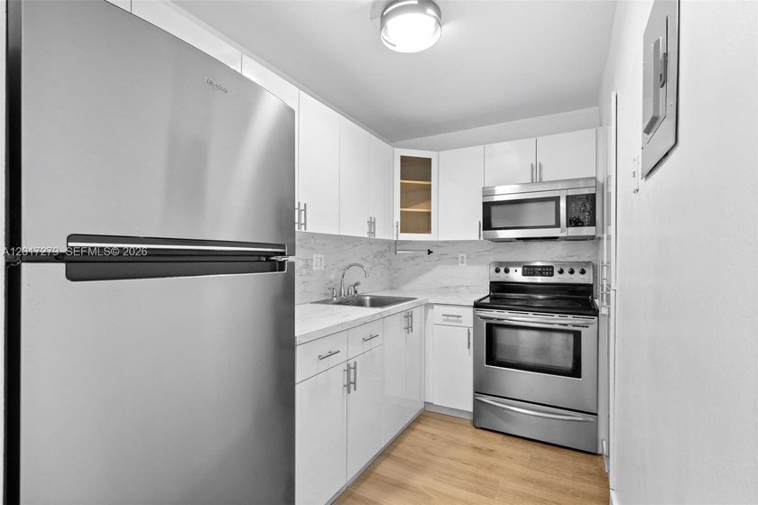 Bright and spacious 2-bed, 1-bath unit on the top floor with a - Beach Condo for sale in Miami, Florida on Beachhouse.com